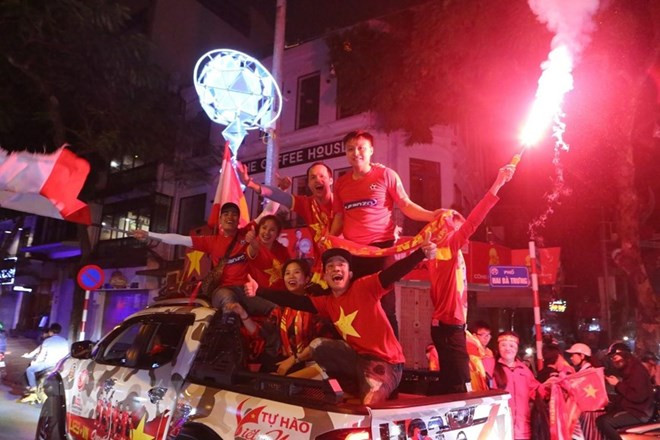 Football fans storm streets to celebrate Vietnam’s U23 team victory